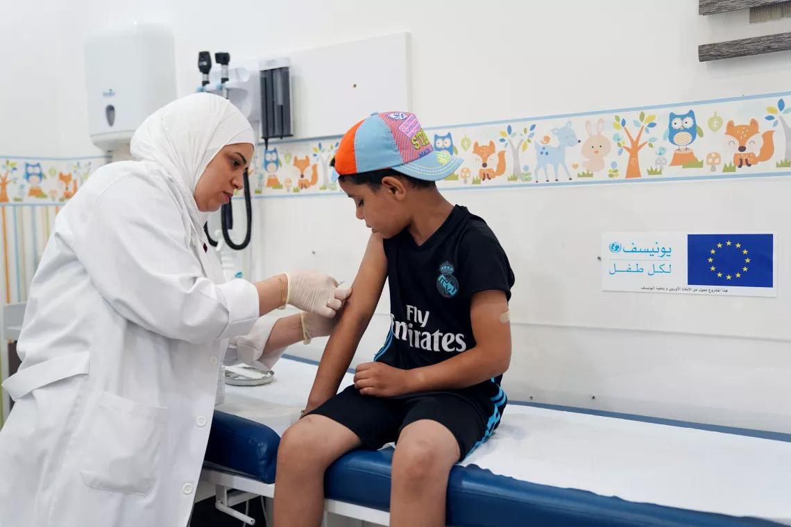 A child receiving a vaccine. (Image Credit: IFRC) A child receiving a vaccine. (Image Credit: IFRC)