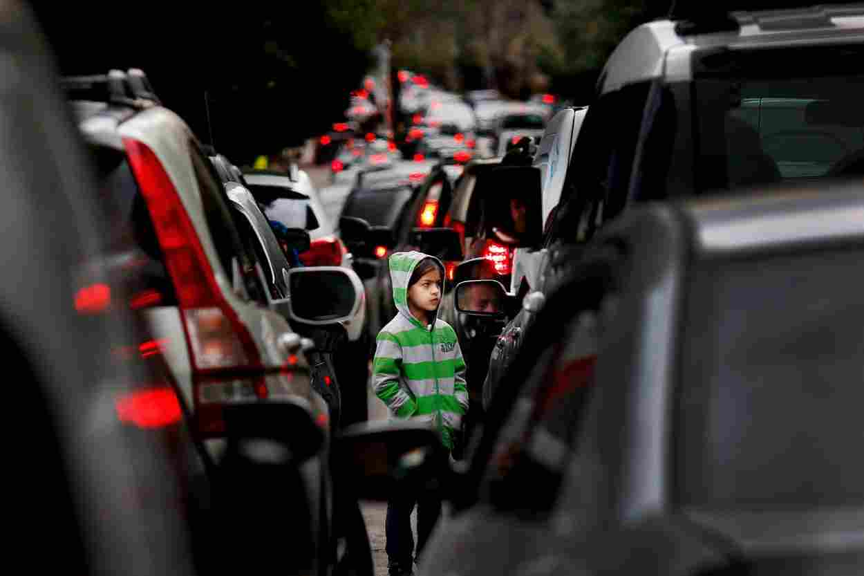 Photo credit: The Jakarta Post / File – A Syrian refugee girl begs for money in traffic in Beirut, Lebanon, February 10, 2016.