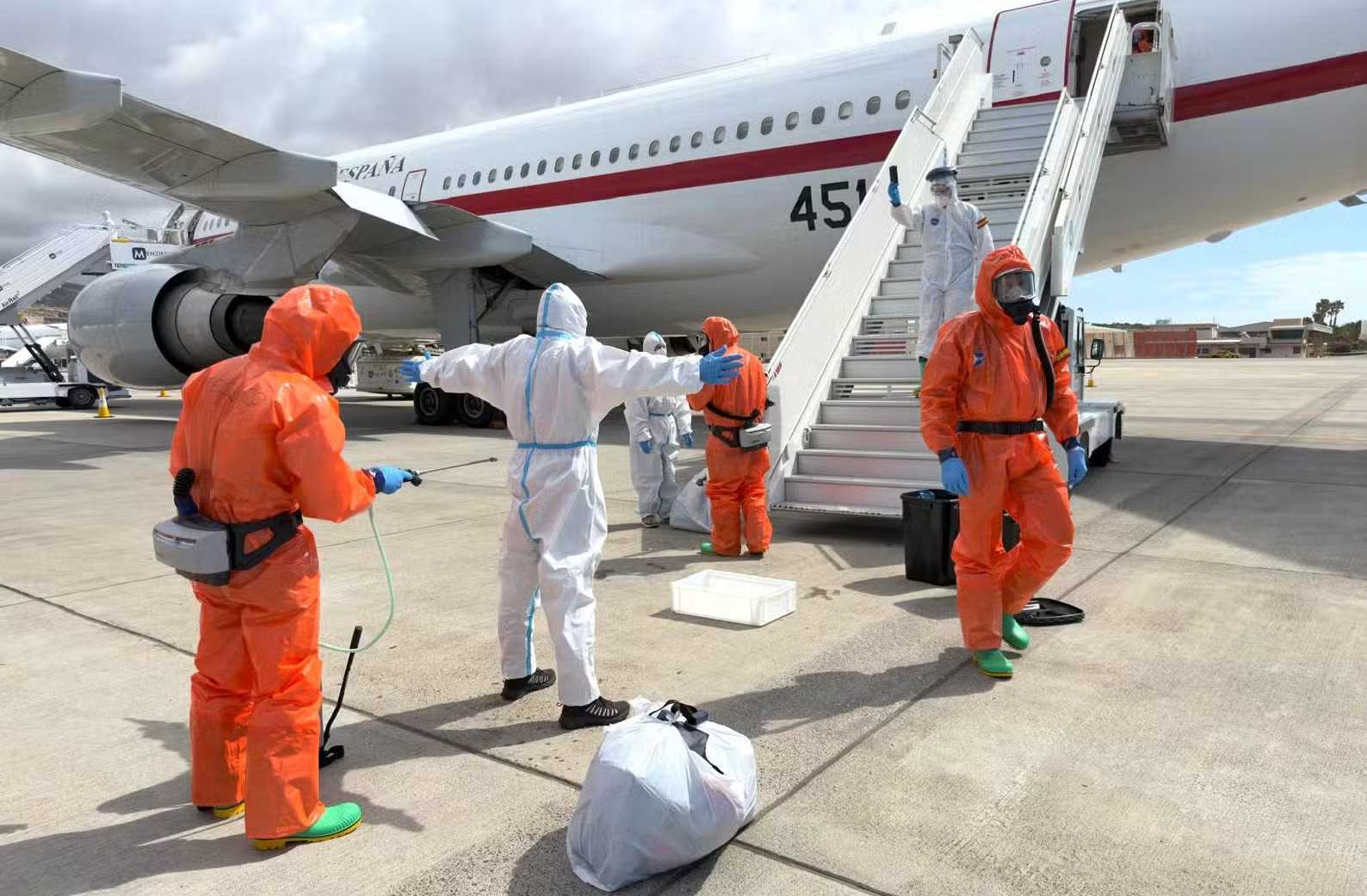 A Spanish passenger is sprayed with disinfectant by Spanish government officials before boarding a plane after disembarking from the hantavirus-stricken cruise ship MV Hondius at Tenerife airport in the Canary Islands, Spain, Sunday, May 10, 2026. Associated Press