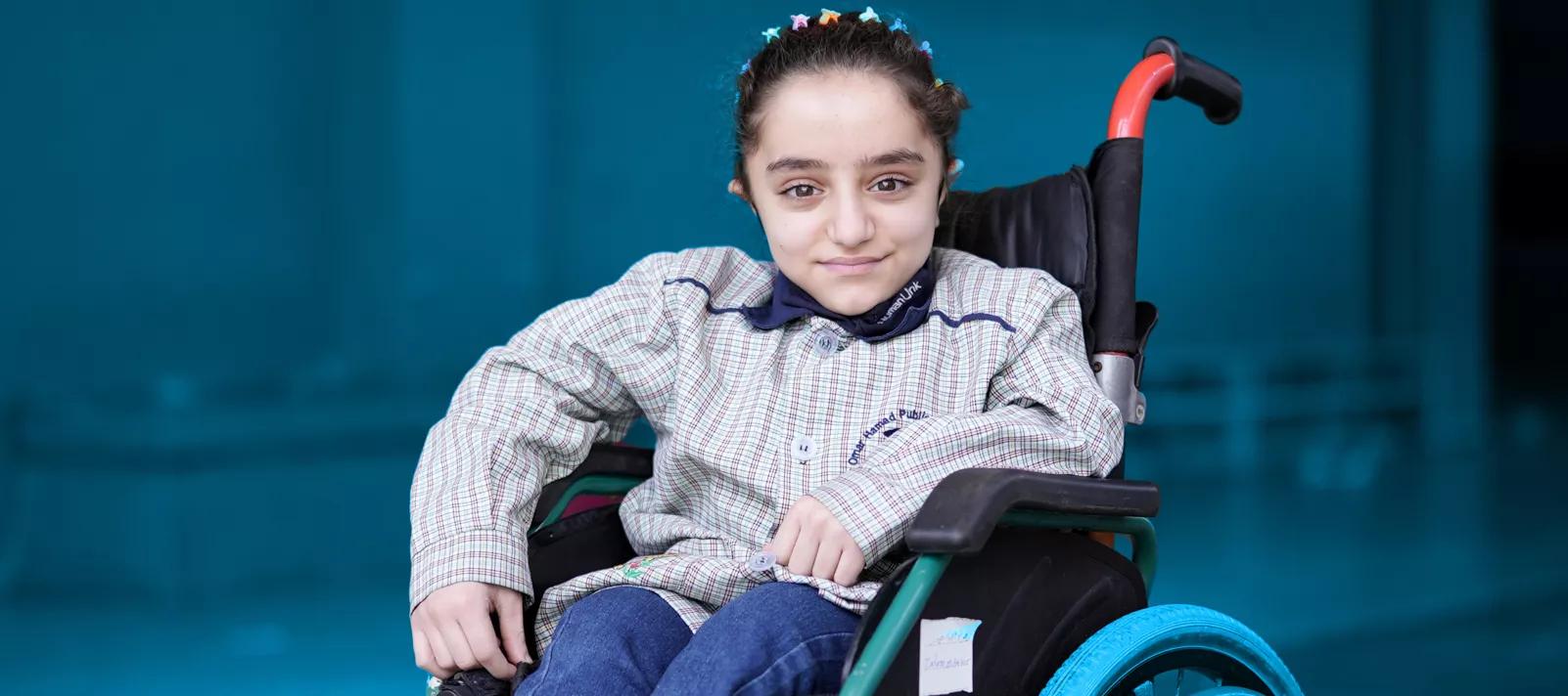 Smiling girl in a wheelchair, UNICEF Lebanon website. Smiling girl in a wheelchair, UNICEF Lebanon website.