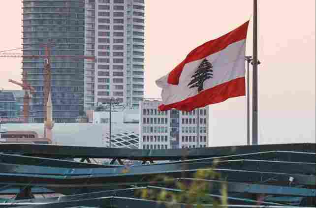 The Lebanese flag waves over the Beirut skyline