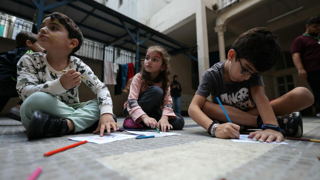 Children from towns in southern Lebanon sit in a shelter in the capital, Beirut. © AFP Children from towns in southern Lebanon sit in a shelter in the capital, Beirut. © AFP