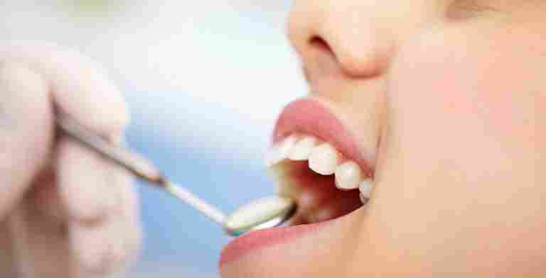 A close-up shot of a patient receiving a dental examination