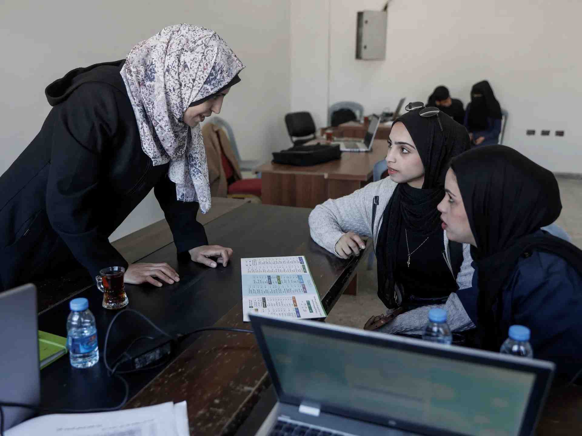Students during an in-person university lecture in Gaza. (Credit: Al Jazeera)