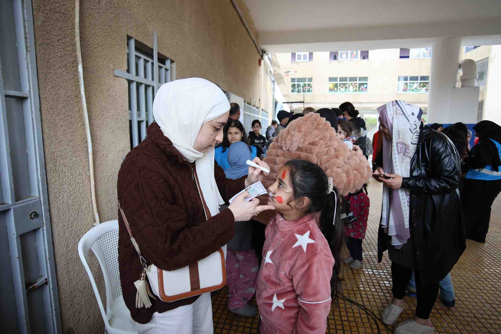 Girl getting face painted