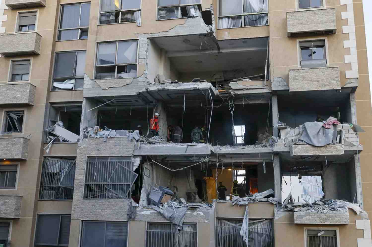 Emergency services inspect the damage after an Israeli strike targeted an apartment at a building in the Aisha Bakkar neighborhood, Beirut, Lebanon, 11 March 2026. (EPA)