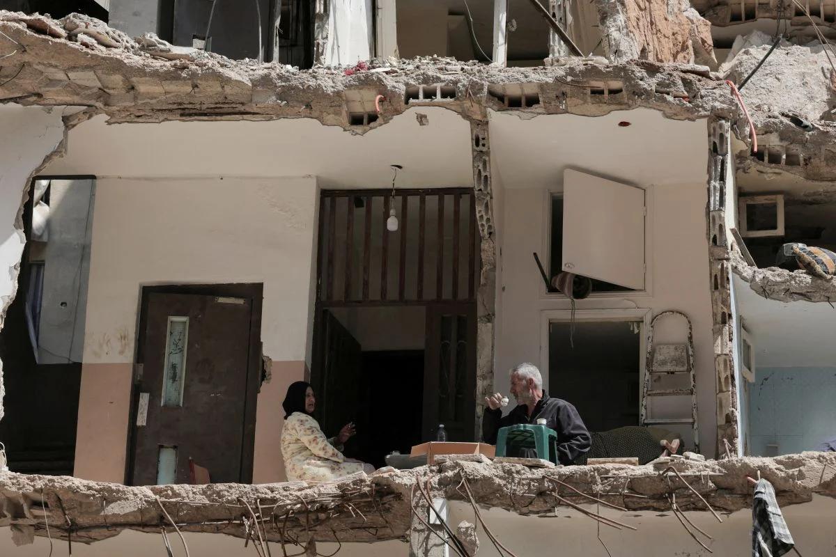 Ali Soueidane, 60 years old, originally from South Lebanon, has coffee with his wife in their house damaged by an Israeli bombardment. Photo Raghed Waked/Reuters Ali Soueidane, 60 years old, originally from South Lebanon, has coffee with his wife in their house damaged by an Israeli bombardment. Photo Raghed Waked/Reuters